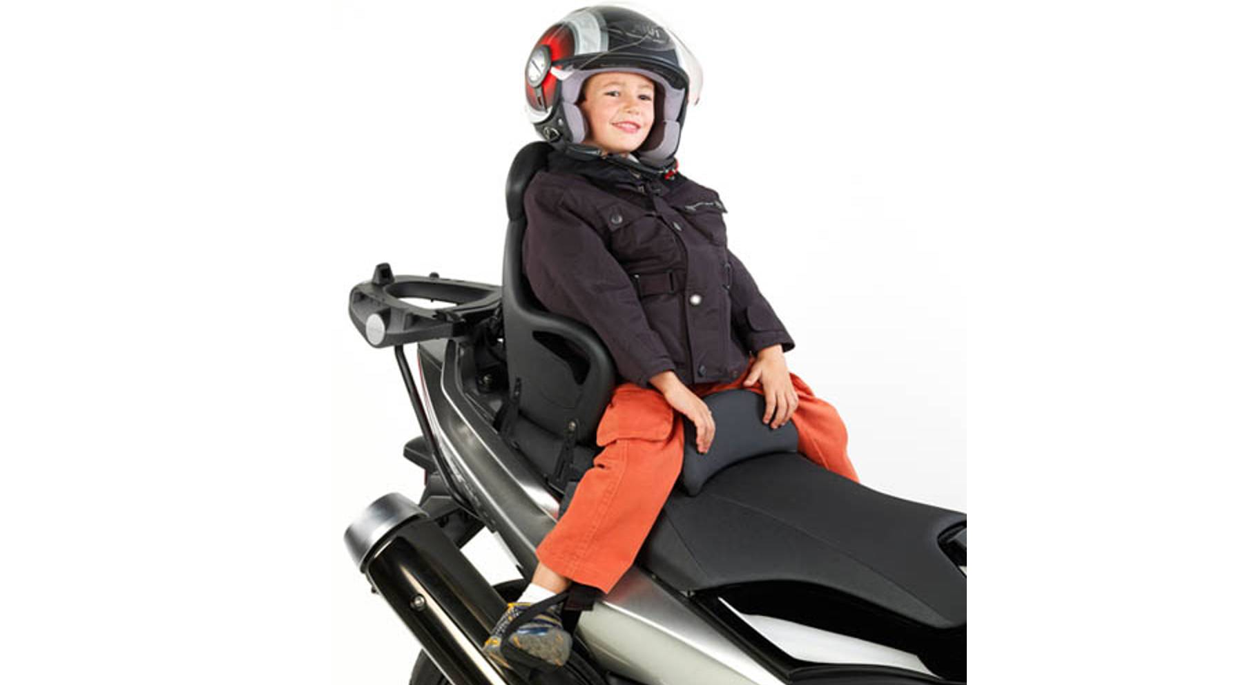 What is the minimum age to take a child on a motorcycle?