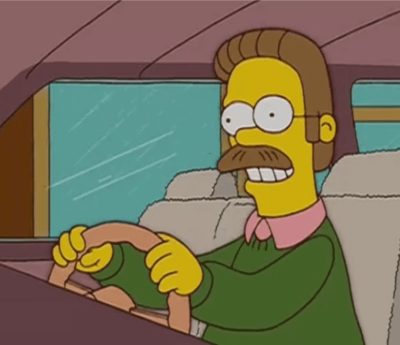 ned flanders conduce por la izquierda